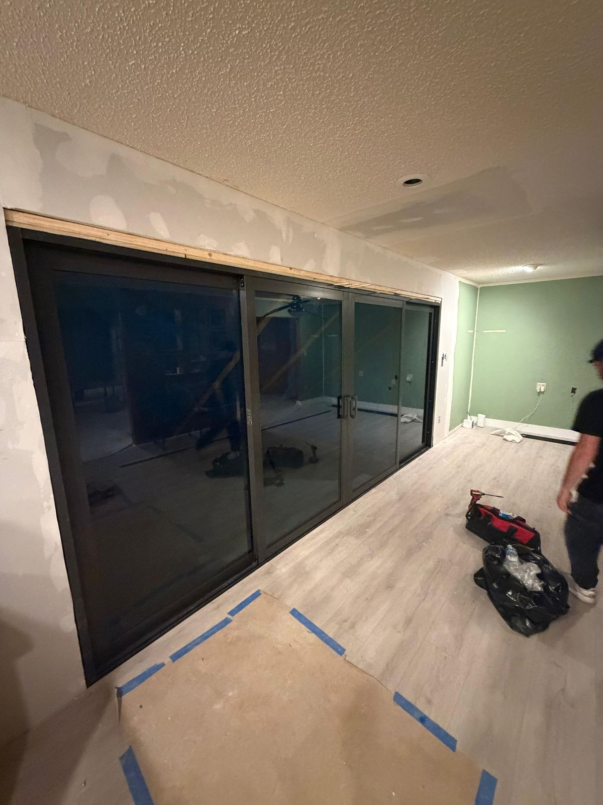 Happy homeowner opening a smoothly working sliding door