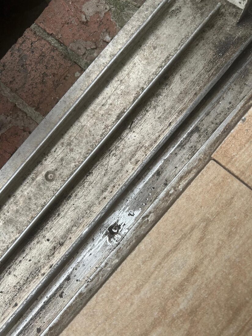 Worn and dirty sliding door track